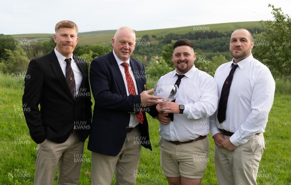 300526 - Rhymney RFC, Admiral National League 2 East Trophy Presentation - Colin Wilks, WRU National Council Member presents Rhymney RFC captain Tyler Evans with the league trophy, alongside Head Coach Lee Pearson, left, and Anthony Lott, forwards coach,after Rhymney win Admiral National League 2 East