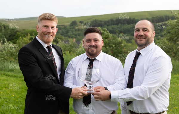 300526 - Rhymney RFC, Admiral National League 2 East Trophy Presentation - Rhymney RFC captain Tyler Evans with the league trophy, along with Head Coach Lee Pearson, left, and Anthony Lott, forwards coach, after Rhymney win Admiral National League 2 East