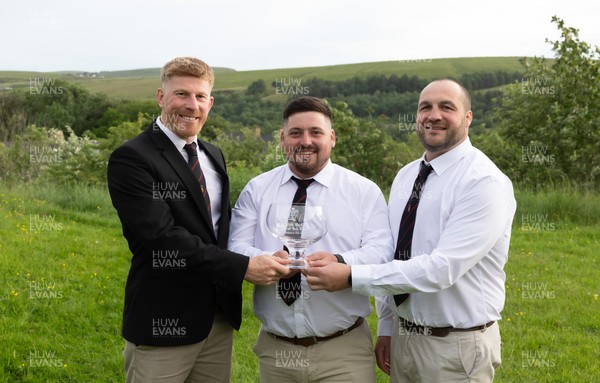 300526 - Rhymney RFC, Admiral National League 2 East Trophy Presentation - Rhymney RFC captain Tyler Evans with the league trophy, along with Head Coach Lee Pearson, left, and Anthony Lott, forwards coach, after Rhymney win Admiral National League 2 East