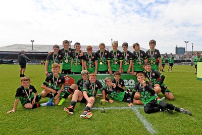 210525 - Rhymney Valley and Caerphilly District v Pembs Schools  - WSRU Junior Group - U11s DC Thomas Bowl Final - Rhymney Valley and Caerphilly District players celebrate lifting the trophy 