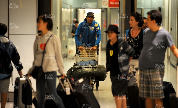 16.07.11 - Former Wales rugby player Richard Parks arrives back at London Heathrow airport after completing his 737 world record attempt. 