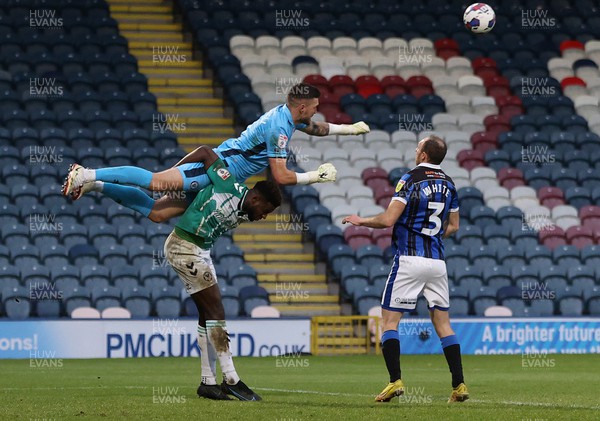 070123 - Rochdale v Newport County - Sky Bet League 2 - Goalkeeper Richard O'Donnell of Rochdale lands on Offrande Zanzala of Newport County as he punches the ball away