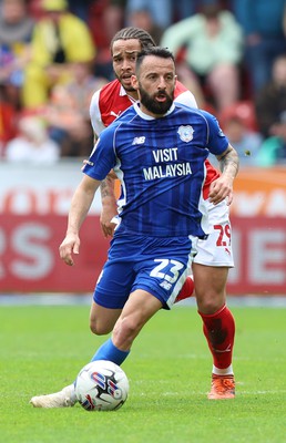 040524 - Rotherham United v Cardiff City - Sky Bet Championship - Manolis Siopis of Cardiff is followed by Sam Nombe of Rotherham United