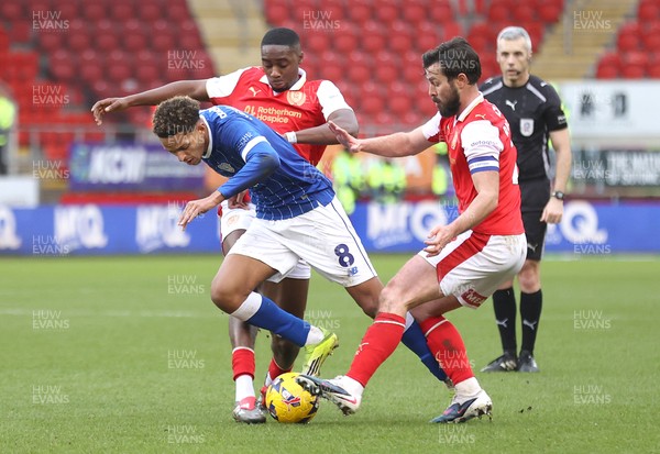 070226 - Rotherham United v Cardiff City - Sky Bet League 1 - Omari Kellyman of Cardiff tries to pass Emmanuel Adegboyega of Rotherham in the 1st half with Joe Rafferty of Rotherham