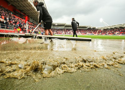 180323 - Rotherham United v Cardiff City - Sky Bet Championship - Groundsmen try and clear the pitch after the game is stopped due to a heavy downpour 