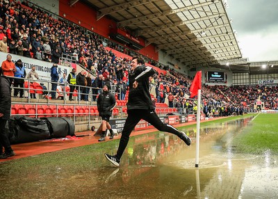 180323 - Rotherham United v Cardiff City - Sky Bet Championship - A groundsmen jumps over the corner area after the game is stopped due to a heavy downpour 