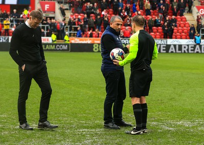 180323 - Rotherham United v Cardiff City - Sky Bet Championship - Cardiff Manager Sabri Lamouchi and Rotherham Manager Matt Taylor inspect the pitch with referee Oliver Langford after the game is stopped after a heavy downpour