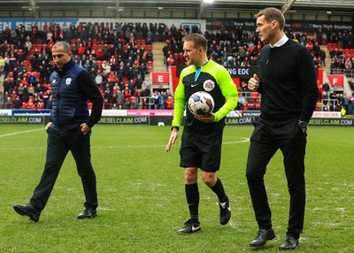 180323 - Rotherham United v Cardiff City - Sky Bet Championship - Cardiff Manager Sabri Lamouchi and Rotherham Manager Matt Taylor inspect the pitch with referee Oliver Langford after the game is stopped after a heavy downpour