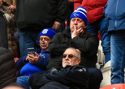 180323 - Rotherham United v Cardiff City - Sky Bet Championship - Cardiff fans sit and wait for a decision on the play after the game is stopped after a heavy downpour