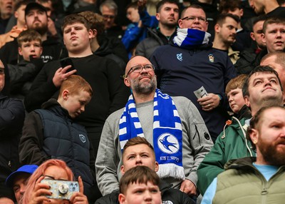 180323 - Rotherham United v Cardiff City - Sky Bet Championship - Cardiff fans look dejected as they wait for a decision on play after the game is stopped after a heavy downpour