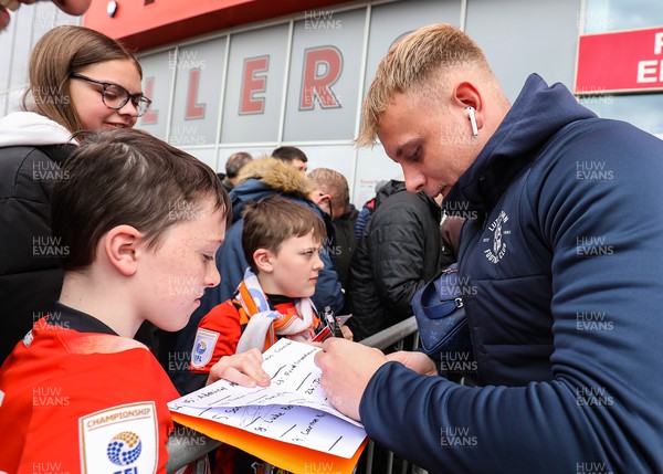 150423 - Rotherham United v Luton Town - Sky Bet Championship - Joe Taylor of Luton Town signs an autograph with a fan on his arrival to New York Stadium