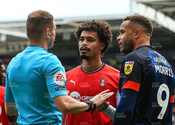 150423 - Rotherham United v Luton Town - Sky Bet Championship - Referee Leigh Doughty talks with Cameron Humphreys of Rotherham and Carlton Morris of Luton Town after a rough tackle