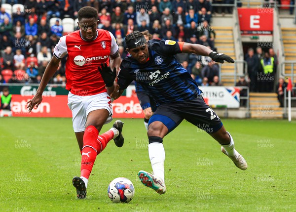 150423 - Rotherham United v Luton Town - Sky Bet Championship - Amari’i Bell of Luton Town jostles for possession with Wes Harding of Rotherham