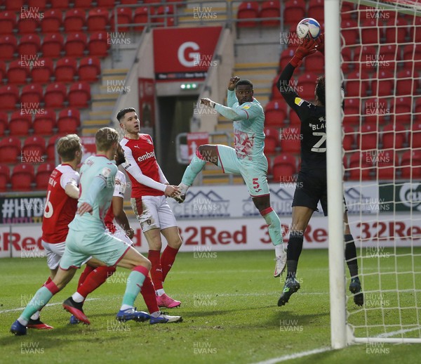 300121 - Rotherham United v Swansea City - Sky Bet Championship - Jamal Blackman of Rotherham United saves from Marc Guehi of Swansea