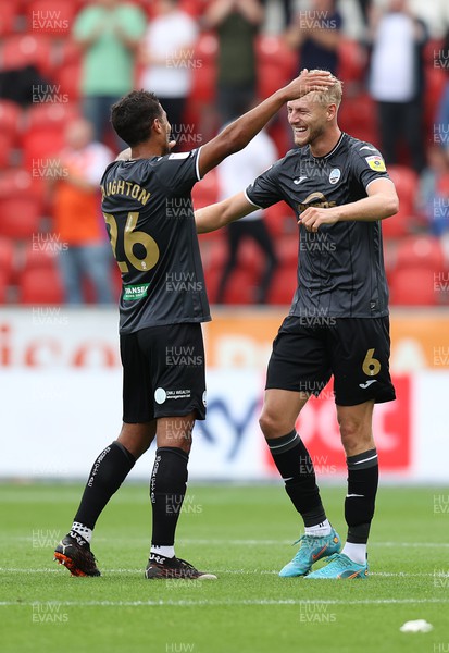 300722 - Rotherham United v Swansea City - Sky Bet Championship - Harry Darling of Swansea celebrates with Kyle Naughton after shooting from mid field to score the Swans' 1st goal