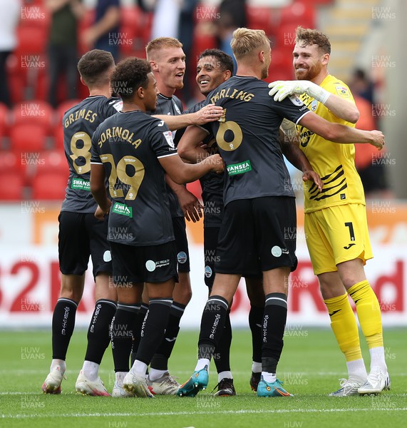 300722 - Rotherham United v Swansea City - Sky Bet Championship - Harry Darling of Swansea celebrates with Kyle Naughton, Jay Fulton, Matt Grimes and Goalkeeper Andy Fisher after shooting from mid field to score the Swans' 1st goal