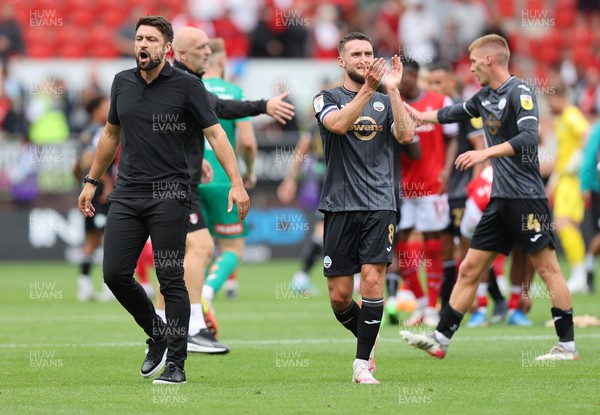 300722 - Rotherham United v Swansea City - Sky Bet Championship - Head Coach Russell Martin  of Swansea and Matt Grimes of Swansea [captain] at the end of the match applaud the fans