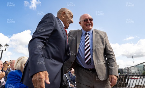 190723 - Cardiff Bay Rugby Codebreakers Statue Unveiling - Rugby league legends Billy Boston, left, and Jim Mills during the unveiling of a statue in Cardiff Bay to celebrate the achievements of rugby players from Cardiff Bay who joined rugby league teams