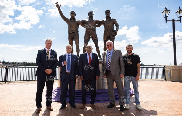 190723 - Cardiff Bay Rugby Codebreakers Statue Unveiling -  Left to right, Martin Risman, Sir Stanley Thomas, Billy Boston, Jim Mills and Kane Sullivan during the unveiling of a statue in Cardiff Bay to celebrate the achievements of rugby players from Cardiff Bay who joined rugby league teams