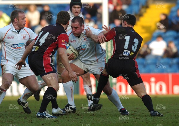 150106 - Heineken Cup Rugby Sale Sharks v Newport Gwent Dragons  Dragons' Adam Black tries to get past Mark Cueto and Mark Taylor 