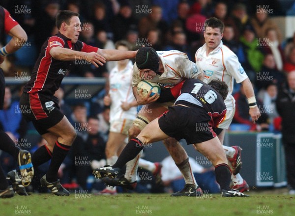 150106 - Heineken Cup Rugby Sale Sharks v Newport Gwent Dragons  Dragons' Michael Owen tries to get past Mark Taylor and Andy Titterall 