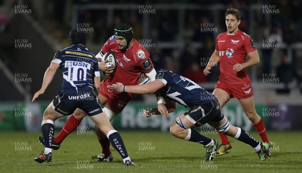 210117 - Sale Sharks v Scarlets - European Rugby Champions Cup - Tom Price of Scarlets is tackled by AJ MacGinty and George Nott of Sale Sharks by Chris Fairweather/Huw Evans Agency