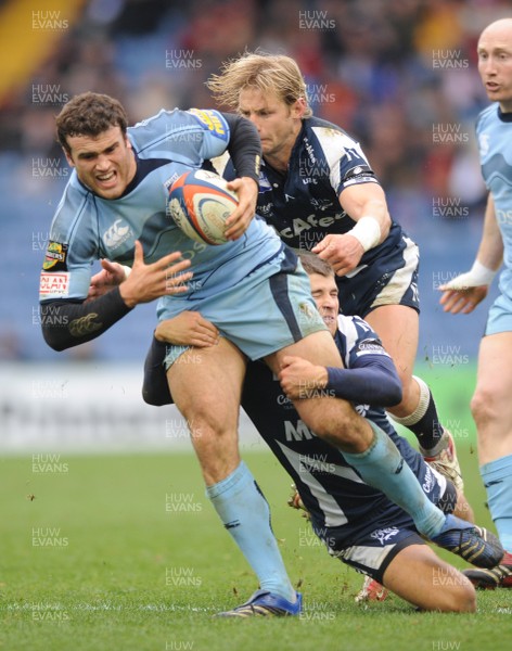 03.10.08 - Sale Sharks v Cardiff Blues - EDF Energy Cup - Cardiff's Jamie Roberts is tackled by Sale's Rudi Keil and Sale's Richard Wigglesworth. 