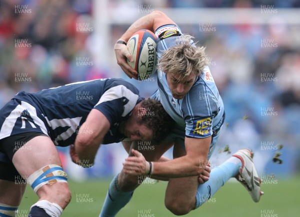 04.10.08 Sale Sharks v Cardiff Blues... Cardiff's Jamie Robinson is tackled by Sale's Jason White. 