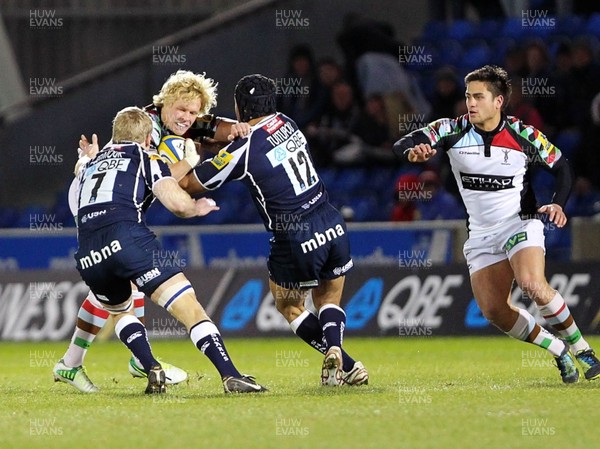 220213 Sale v Harlequins - Aviva Premiership - Matt Hopper of Harlequins is tackled by David Seymour and Sammy Tuitupou of Sale Sharks 