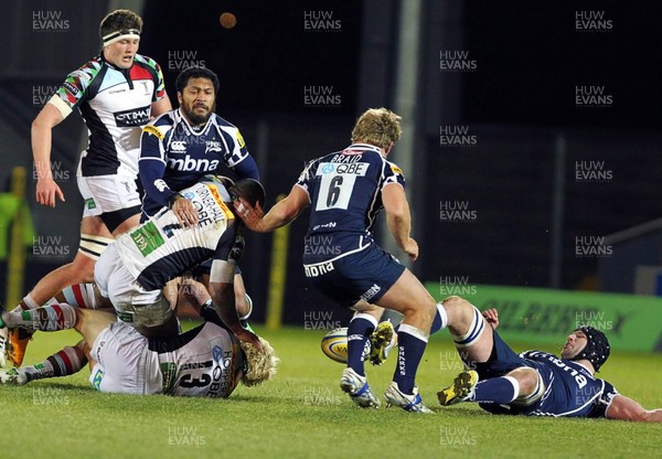 220213 Sale v Harlequins - Aviva Premiership - Dan Braid of Sale Sharks and Jordan Turner-Hall of Harlequins battle for the ball 