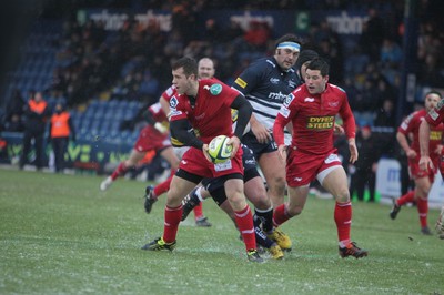 04.02.12 - Sale Sharks v Scarlets - LV= Cup.Scarlets Gareth Davies is tackled.