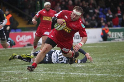 04.02.12 - Sale Sharks v Scarlets - LV= Cup.Peter Edwards of Scarlets shrugs off a tackle from Sale's Nick Macloed to score the Scarlets' first try..