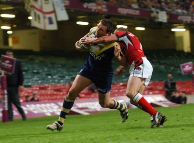 06.05.07 -Salford City Reds v Warrington Wolves Warrington's Martin Gleeson crosses to score try despite the efforts of Luke Robinson 