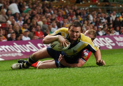 06.05.07 -Salford City Reds v Warrington Wolves Warrington's Martin Gleeson crosses to score try despite the efforts of Luke Robinson 