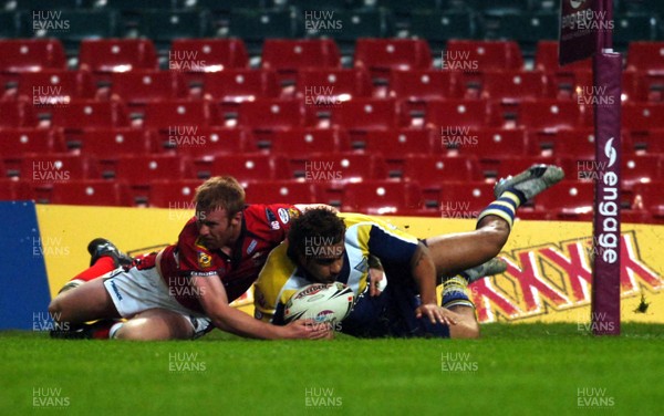 06.05.07 -Salford City Reds v Warrington Wolves Warrington's Henry Fa'afili dives over to score try despite the efforts of David Hodgeson 