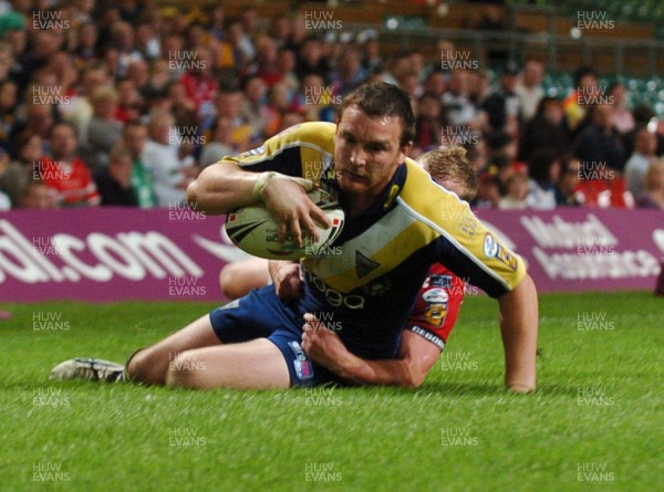 06.05.07 -Salford City Reds v Warrington Wolves Warrington's Martin Gleeson crosses to score try despite the efforts of Luke Robinson 