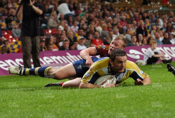 06.05.07 -Salford City Reds v Warrington Wolves Warrington's Martin Gleeson crosses to score try despite the efforts of Luke Robinson 