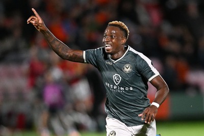 010926 - Salford City v Newport County - Sky Bet League 2 - Shaquille Gwengwe of Newport County runs towards the Newport supporters in celebration after Harrison Biggins of Newport County scores a goal from distance
