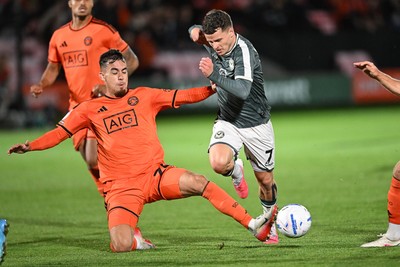 010926 - Salford City v Newport County - Sky Bet League 2 - Kieron Evans of Newport County is challenged by Taylor Allen of Salford