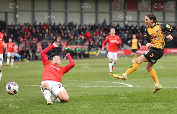 040323 - Salford City v Newport County - Sky Bet League 2 - Aaron Lewis of Newport County tries a shot but blocked by Luke Bolton of Salford City