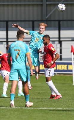 280821 - Salford City v Newport County, Sky Bet League 2 - Ryan Haynes of Newport County heads the ball forward