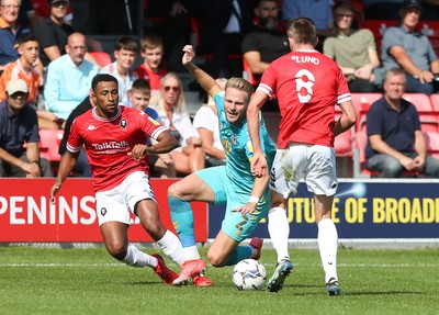 280821 - Salford City v Newport County, Sky Bet League 2 - Cameron Norman of Newport County is brought down