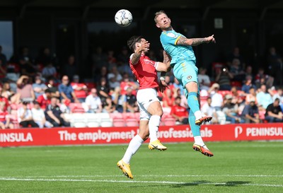 280821 - Salford City v Newport County, Sky Bet League 2 - Alex Fisher of Newport County heads at gaol as Liam Shephard of Salford City challenges