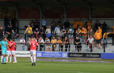 280821 - Salford City v Newport County, Sky Bet League 2 - Newport County fans look on as Salford City celebrate the third goal