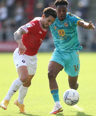 280821 - Salford City v Newport County, Sky Bet League 2 - Timmy Abraham of Newport County and Liam Shephard of Salford City compete for the ball