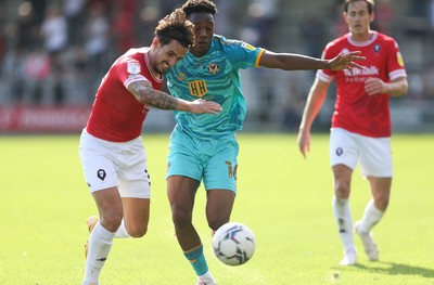 280821 - Salford City v Newport County, Sky Bet League 2 - Timmy Abraham of Newport County and Liam Shephard of Salford City compete for the ball