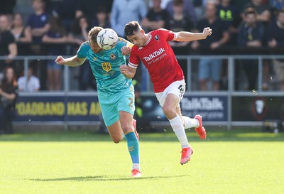 280821 - Salford City v Newport County, Sky Bet League 2 - Cameron Norman of Newport County and Ian Henderson of Salford City compete for the ball