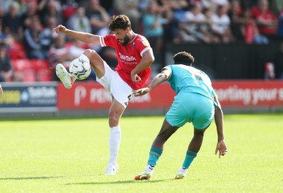 280821 - Salford City v Newport County, Sky Bet League 2 - Jason Lowe of Salford City plays the ball over Timmy Abraham of Newport County