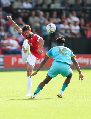 280821 - Salford City v Newport County, Sky Bet League 2 - Jason Lowe of Salford City plays the ball over Timmy Abraham of Newport County