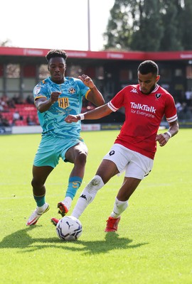 280821 - Salford City v Newport County, Sky Bet League 2 - Timmy Abraham of Newport County competes with Tyreik Wright of Salford City for the ball